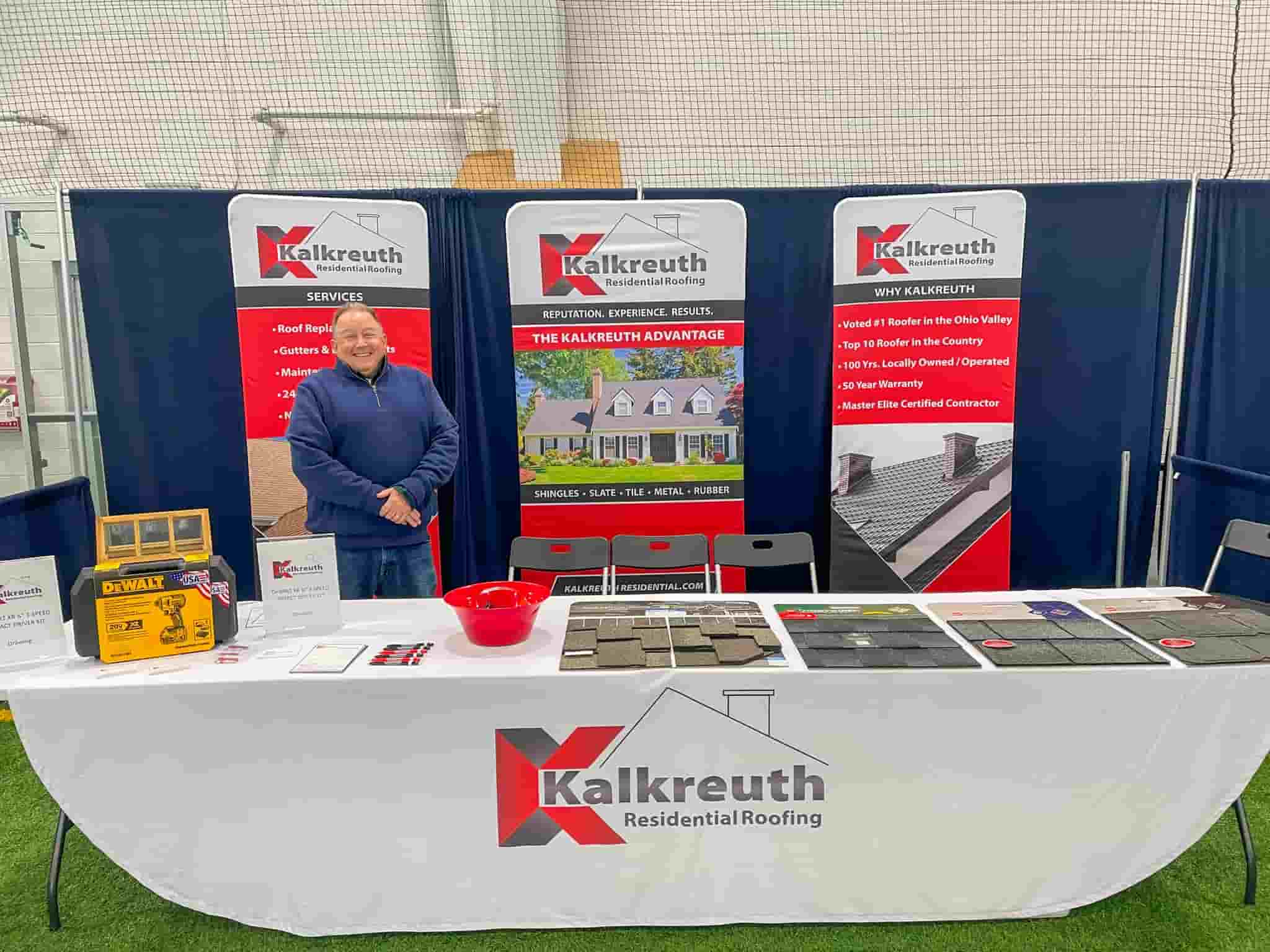 A man stands at a Kalkreuth career booth