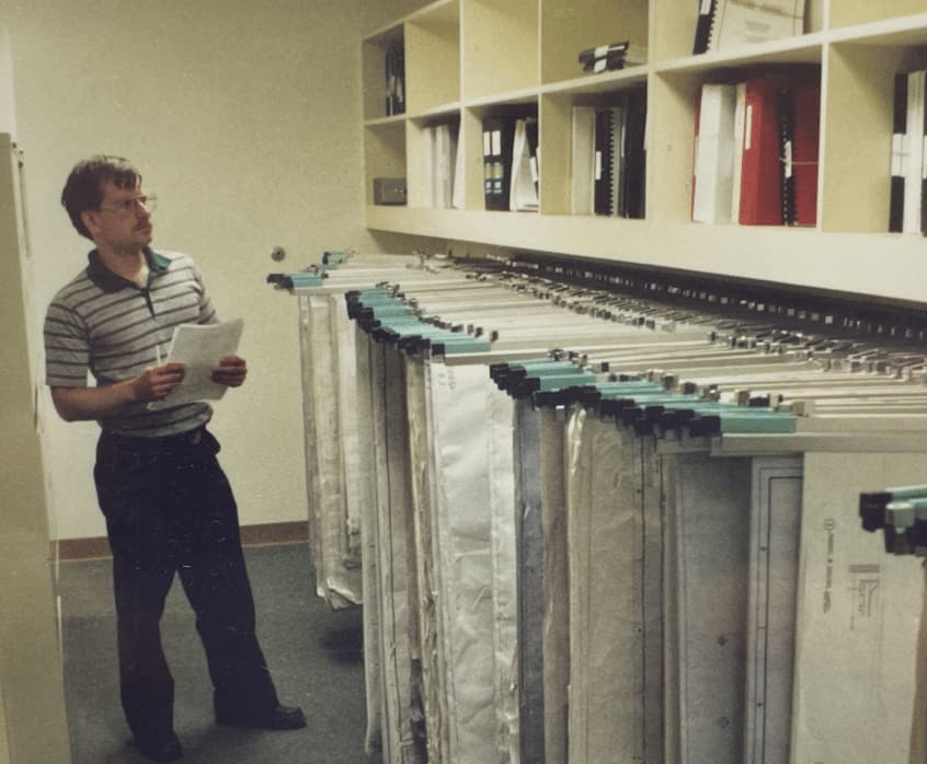 A man with a clipboard surveys supplies
